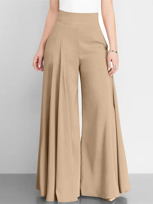Beige wide-leg pants worn by a person on a gray background