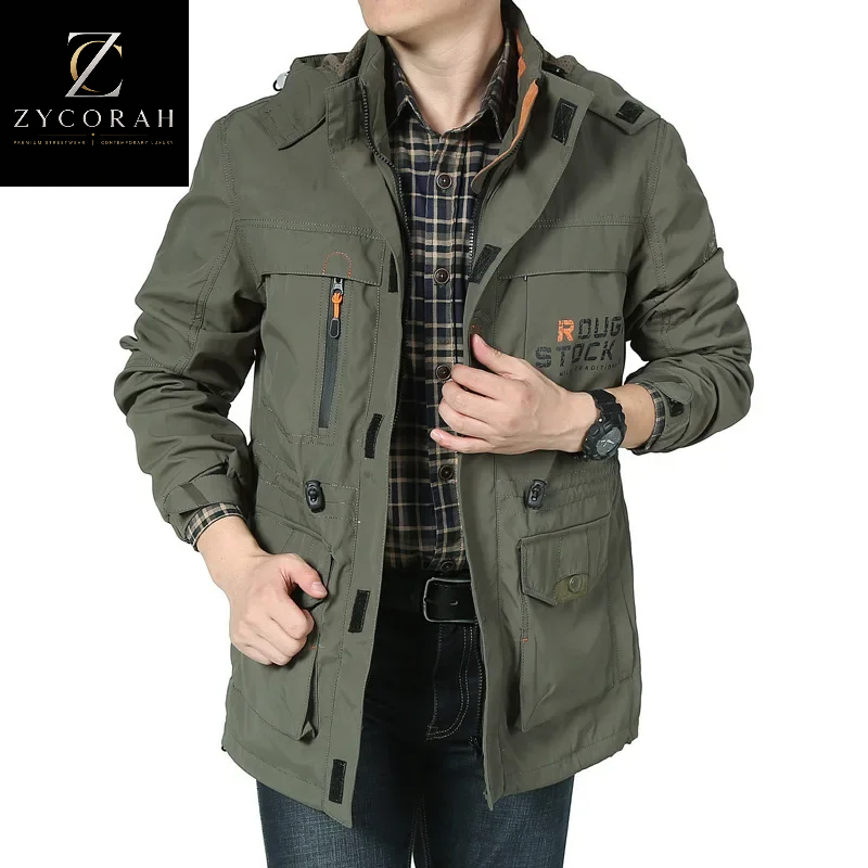 A man wearing an olive green hooded jacket with multiple zippered pockets and a plaid shirt underneath, shown against a white background with a ZYCORAH brand logo in the top-left corner.