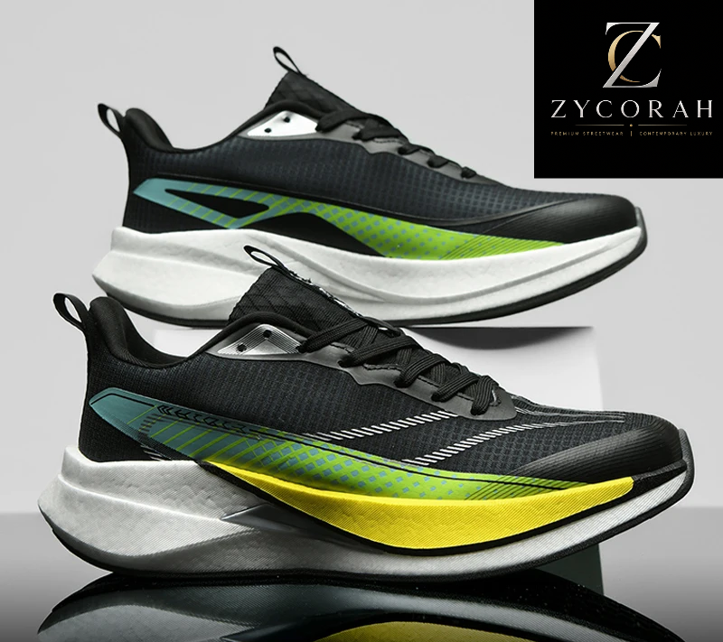A pair of athletic sneakers shown from the side on a light gray studio background, with a black ZYCORAH logo panel in the top right and a promotional banner at the bottom. The shoes are predominantly black with a thick white midsole and a bright green-to-yellow gradient accent on the side.