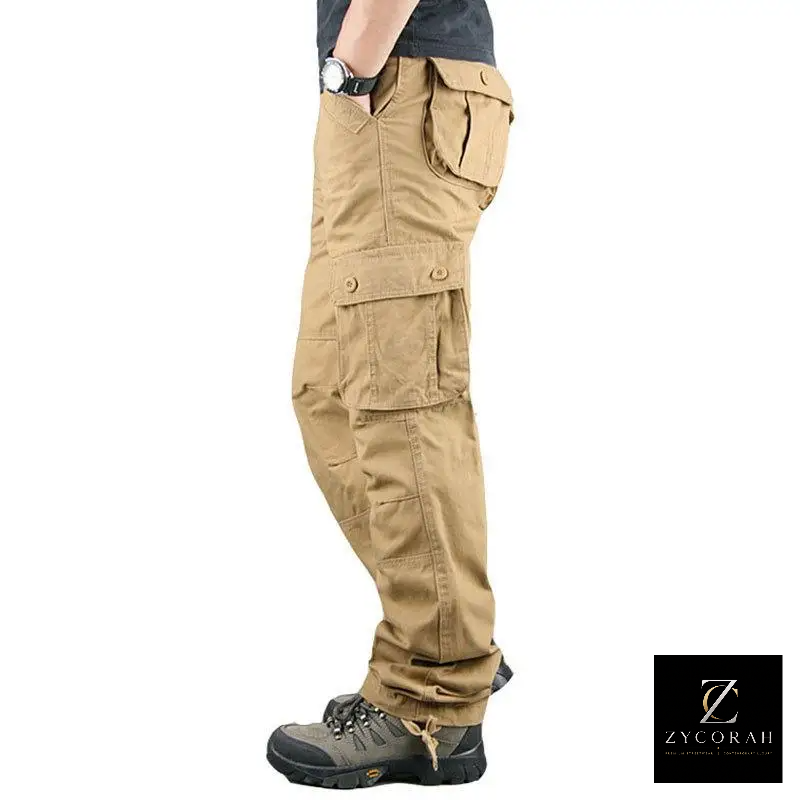 A side profile view of a person wearing tan cargo pants with multiple flap pockets, paired with dark hiking boots, on a white background. A ZYCOKAH brand logo is visible in the bottom right corner.
