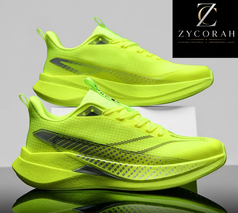 Two bright neon yellow-green athletic sneakers shown on a reflective gray studio background, with a Zycorah brand logo in the top right and a promotional sale banner at the bottom.