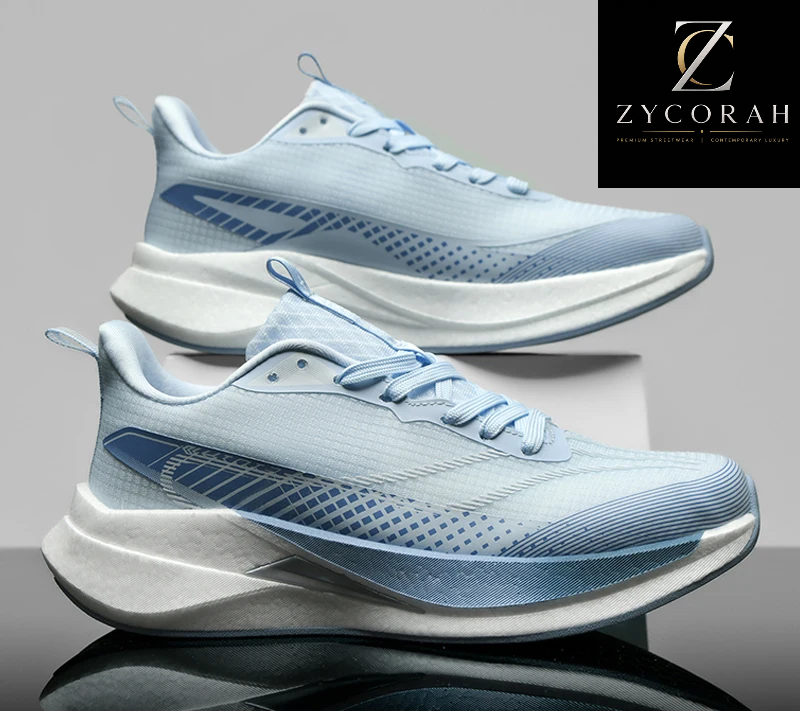 A pair of light blue and white athletic sneakers shown on a reflective gray studio background, with a Zycorah logo in the top right and a promotional 'Good Quality +50% Up to off' banner at the bottom.