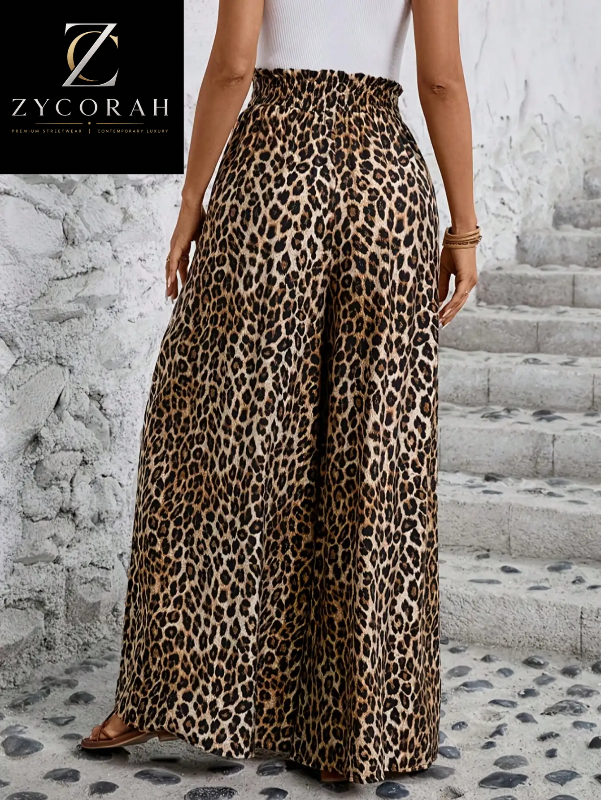 A model wearing Zycorah leopard print wide-leg pants, standing on stone steps against a textured white wall. The brand logo 'Zycorah' is visible in the top left corner.