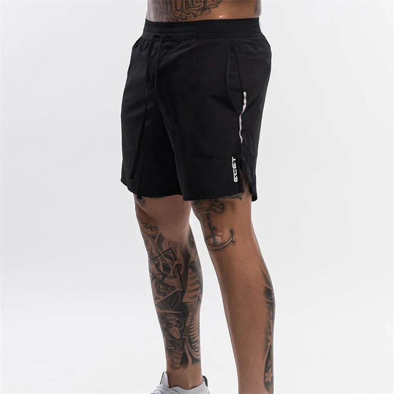 Black athletic shorts worn by a person on a white background