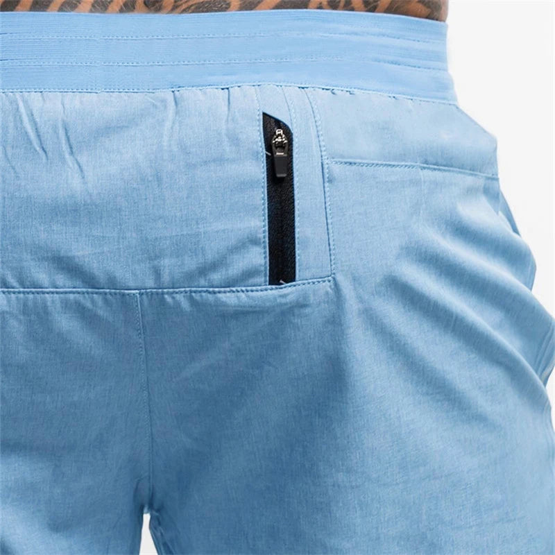 Light blue shorts with a black zipper on a white background