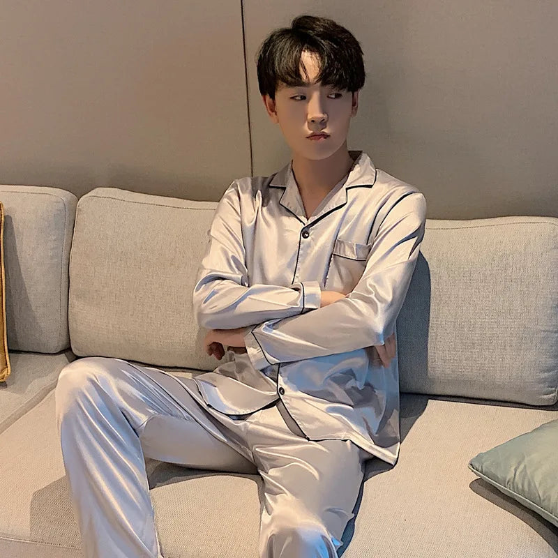 Women's  and men's satin pajama set featuring a button-up long sleeve top and matching pants in red, navy, black, white, purple, and champagne.