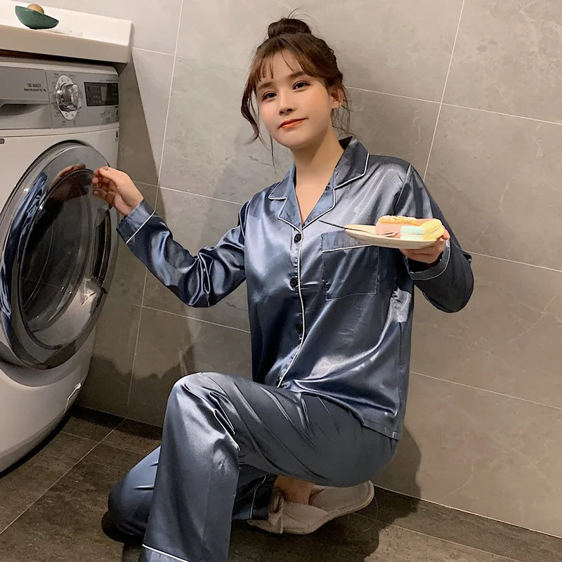 Women's  and men's satin pajama set featuring a button-up long sleeve top and matching pants in red, navy, black, white, purple, and champagne.