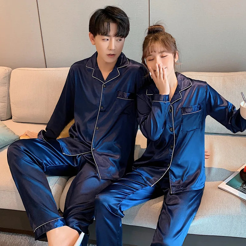 Women's  and men's satin pajama set featuring a button-up long sleeve top and matching pants in red, navy, black, white, purple, and champagne.