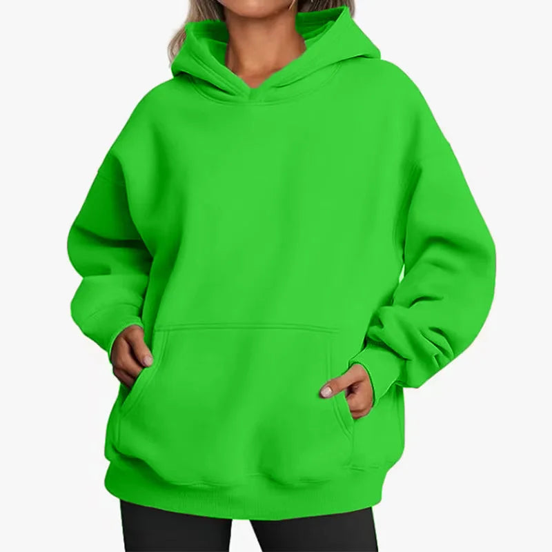 Person wearing a bright green hoodie on a white background