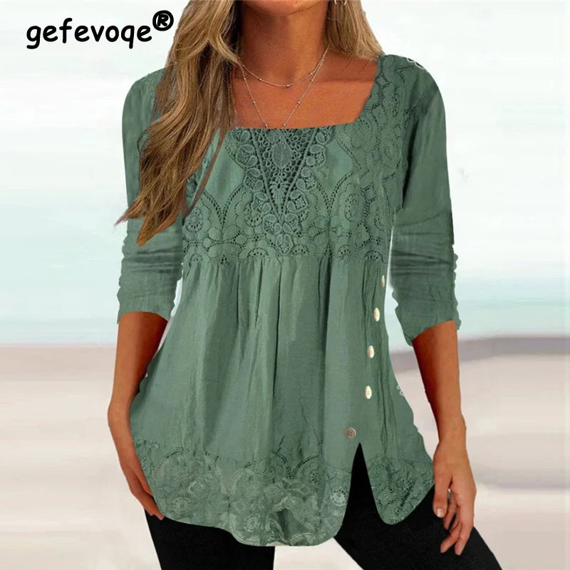 Green lace blouse with buttons on a blurred background