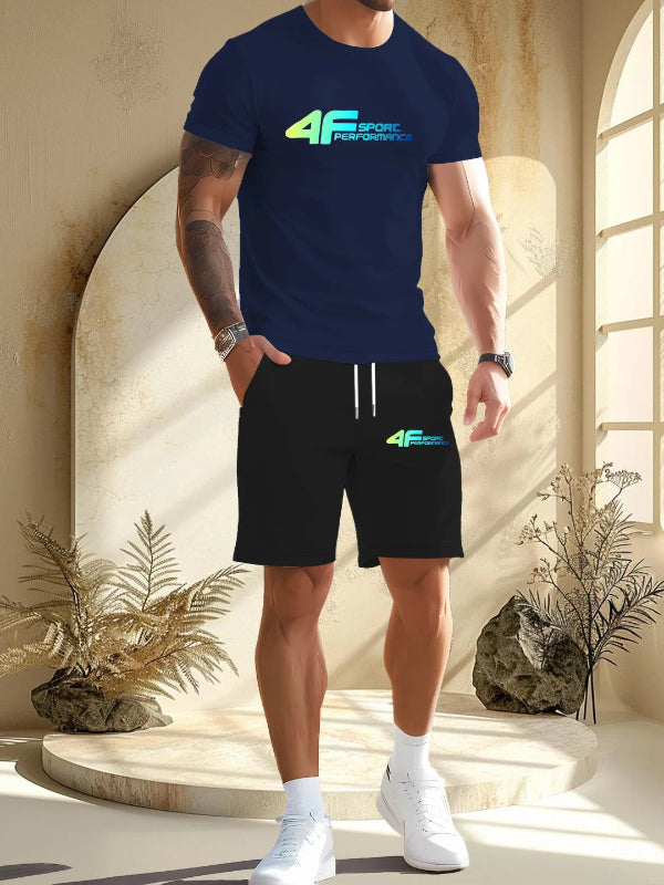 Person wearing a navy blue t-shirt and black shorts with '4F' branding in a sunlit room.
