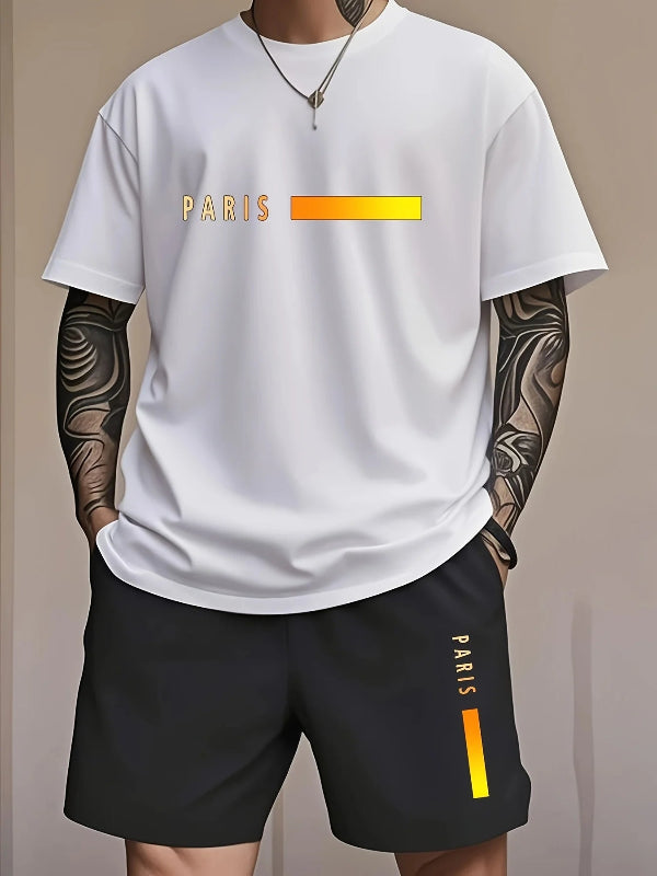 Person wearing a white t-shirt and black shorts with 'PARIS' branding on a beige background
