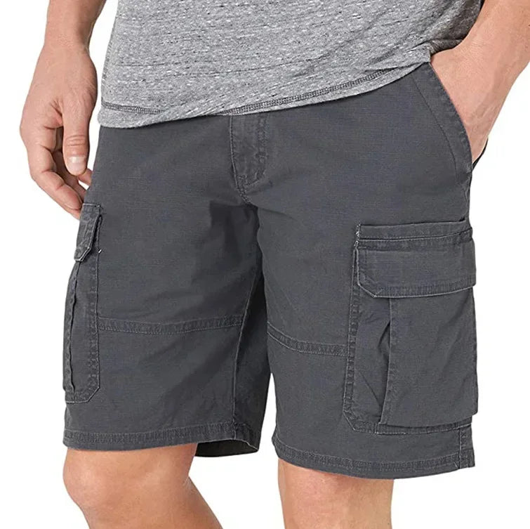 Person wearing gray cargo shorts on a white background