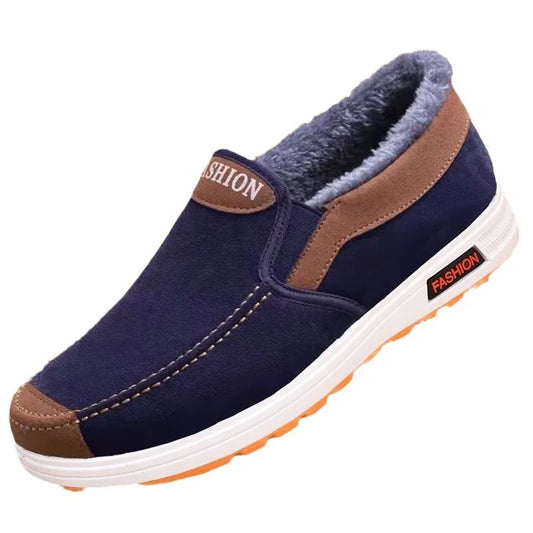 Navy slip-on shoe with brown accents on a white background