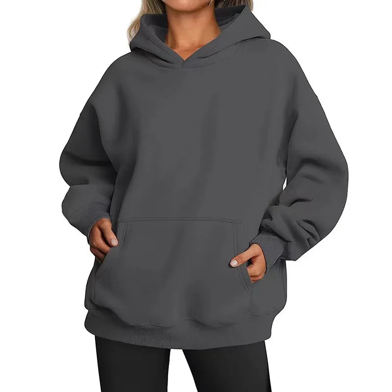 Gray hoodie worn by a person on a white background
