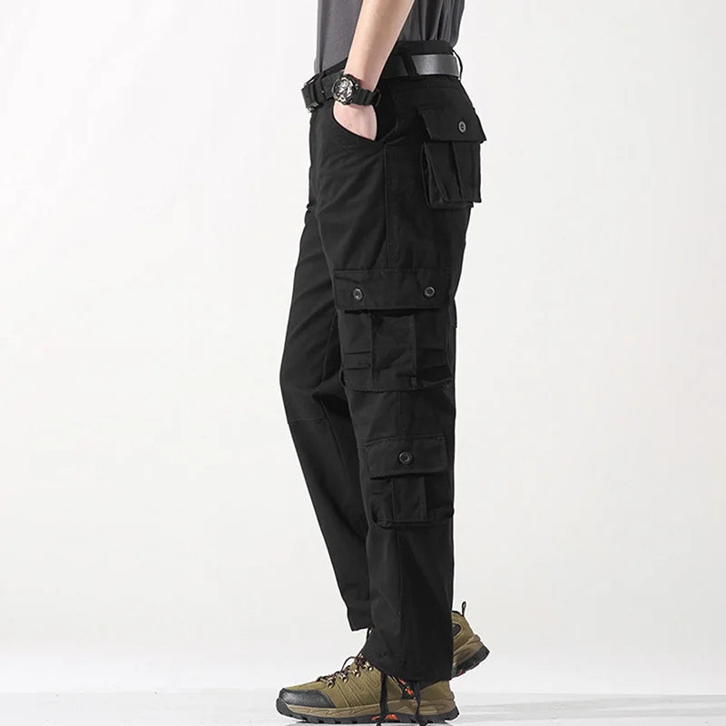 Black cargo pants worn by a person on a white background