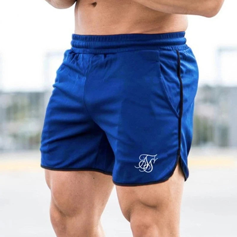 Blue athletic shorts with a logo on a blurred background