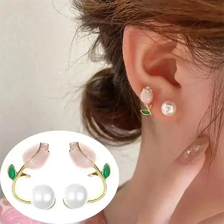 Close-up of an ear wearing a floral earring with pearl-like stones, with a small inset showing the earring details.