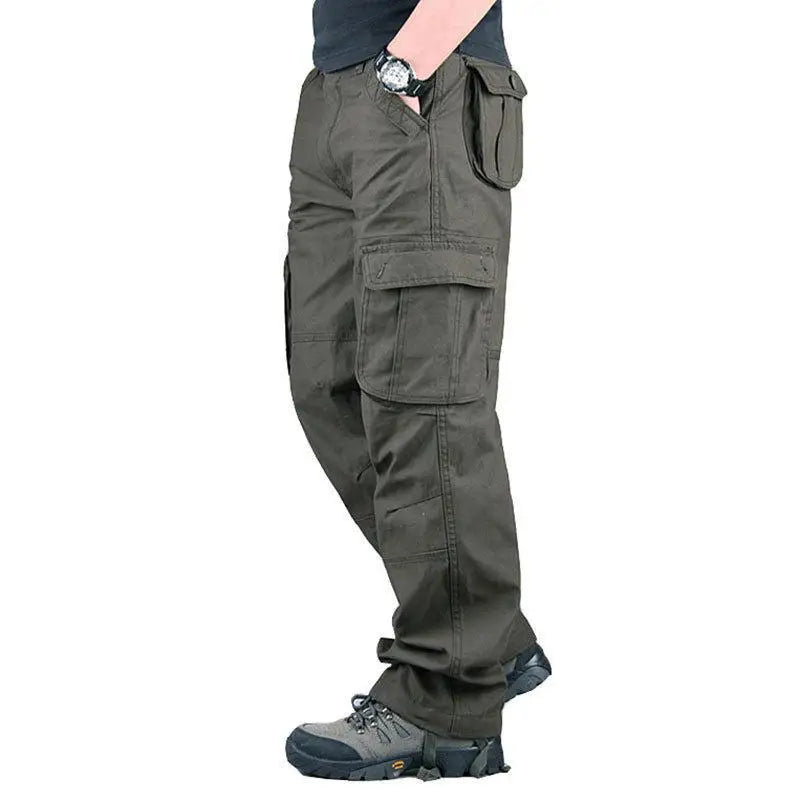 Person wearing gray cargo pants on a white background