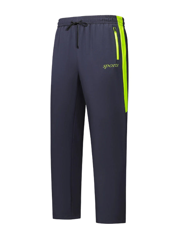 Navy blue sports pants with a green stripe and 'sports' text on a white background