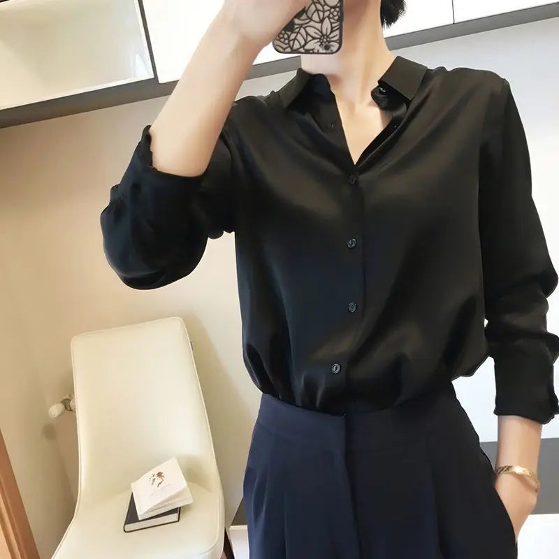 Person wearing a black shirt in an indoor setting