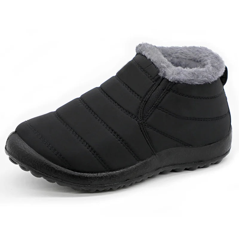 Black winter boot with gray fur lining on a white background