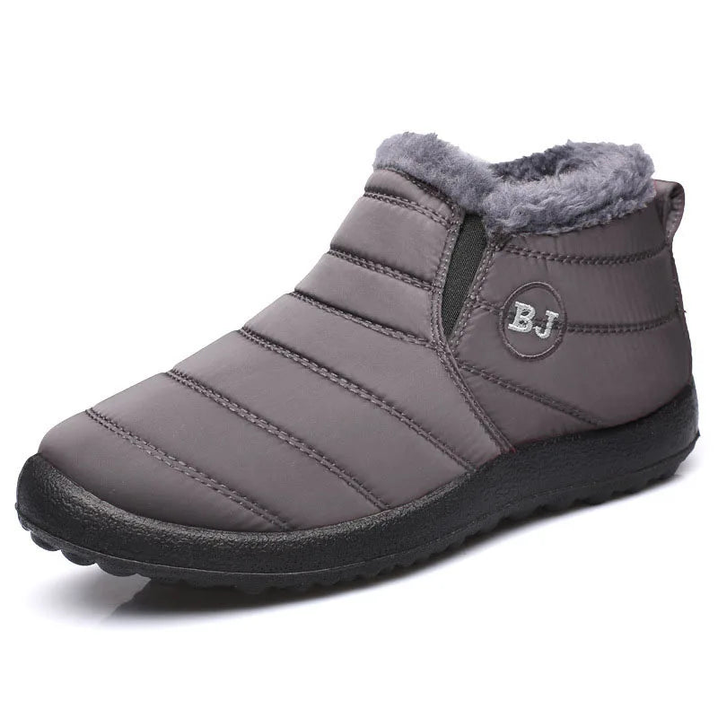 Gray winter boot with fur lining on a white background