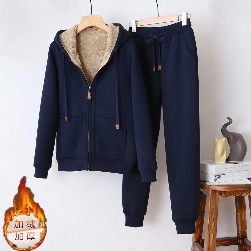 Navy tracksuit with beige lining on a white background
