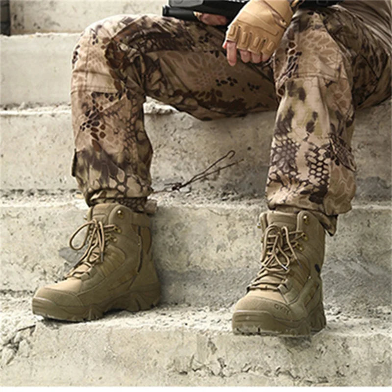 Person wearing camouflage pants and tan tactical boots on concrete steps.