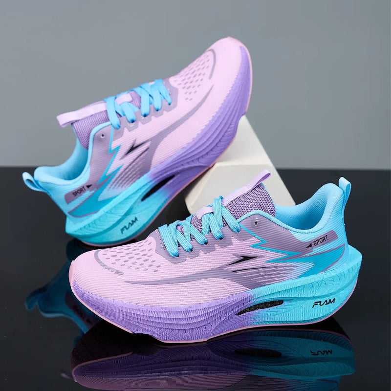 Pair of light purple and blue running shoes on a reflective surface with a gray background
