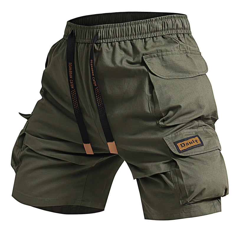 Green cargo shorts with multiple pockets and a brand logo on a white background