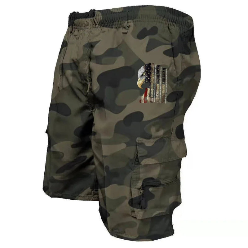 Camouflage shorts with an eagle and flag patch on a white background