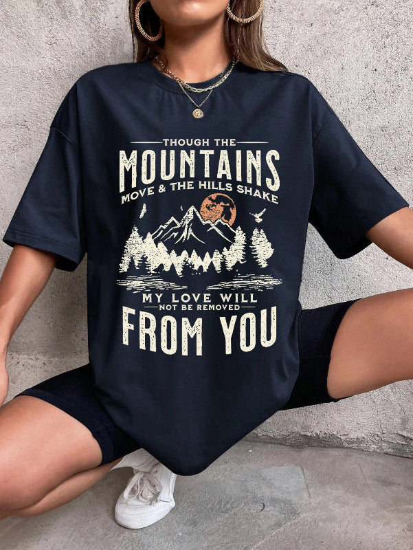 Person wearing a navy blue t-shirt with a mountain design and text.