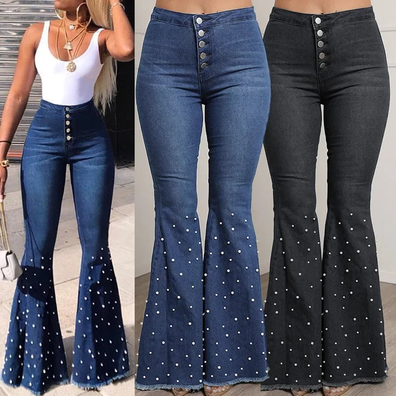 Flared jeans with button details in blue and black, worn by a model.