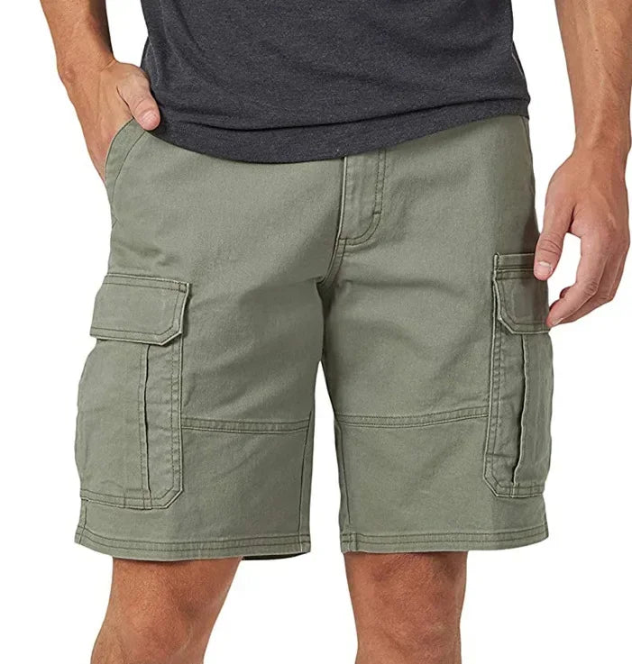 Green cargo shorts worn by a person on a white background