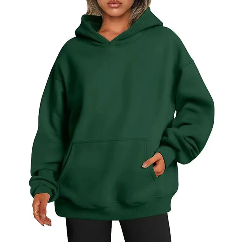 Green hoodie worn by a person on a white background