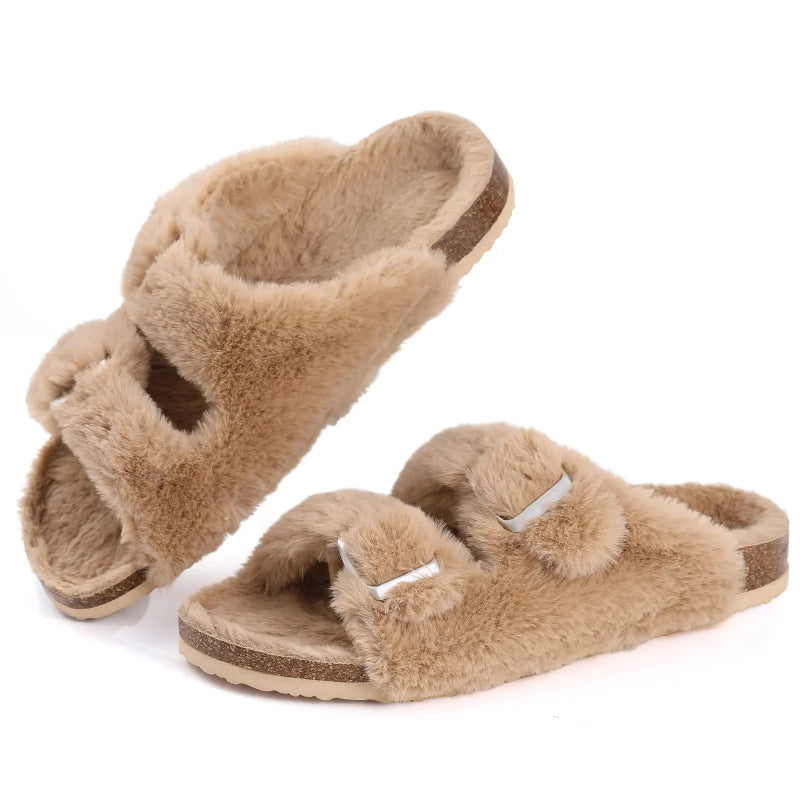 Pair of fluffy beige slippers on a white background