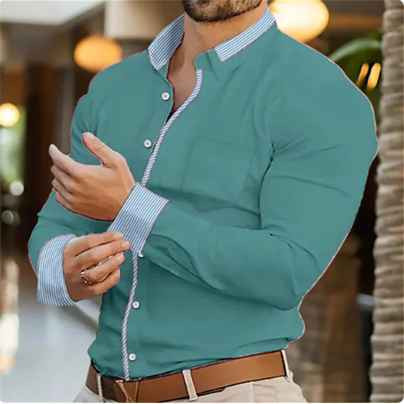 Teal shirt with white trim worn by a person, blurred background