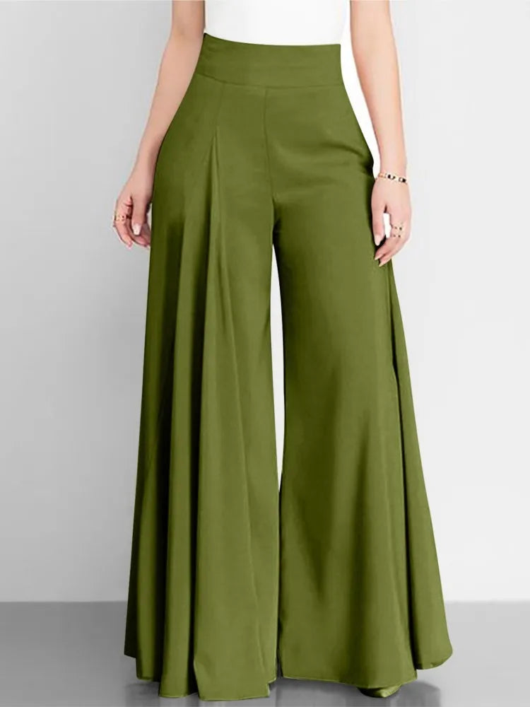 Green wide-leg pants worn by a person on a gray background
