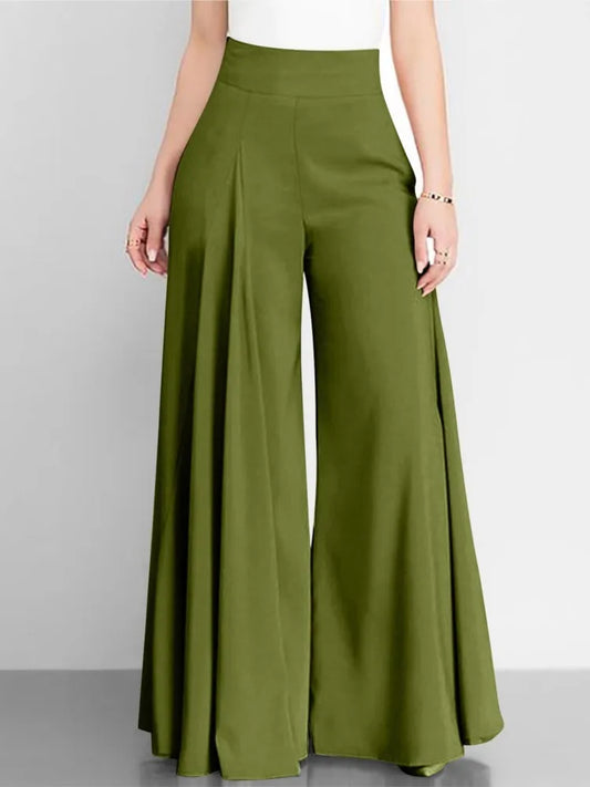 Green wide-leg pants worn by a person on a gray background