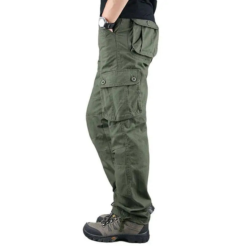 Green cargo pants worn by a person on a white background 07