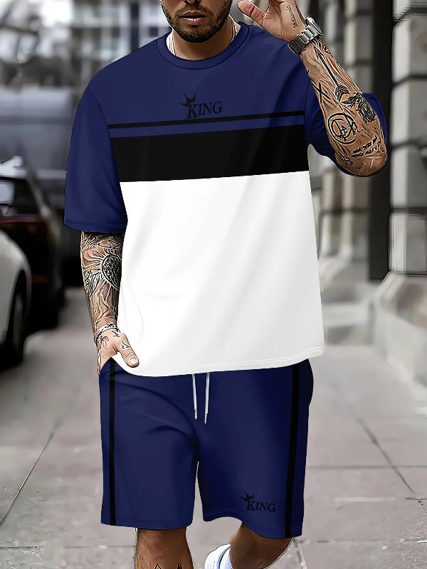 Man wearing a blue and white sports outfit with 'KING' branding on a city street.