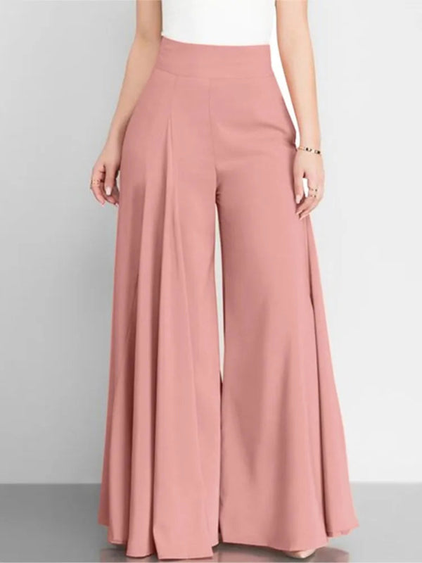 Pink wide-leg pants worn by a person on a gray background