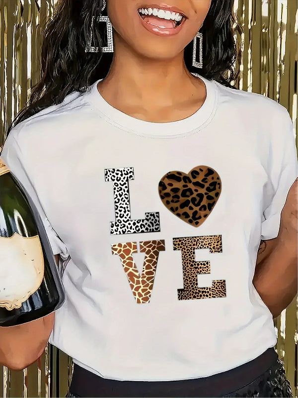 Person wearing a white t-shirt with 'LOVE' in leopard print, holding a bottle.