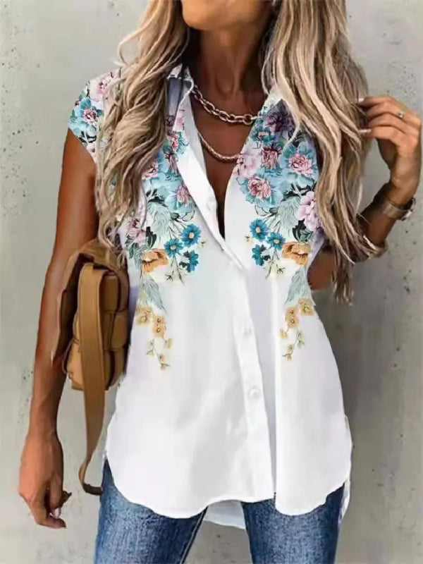 Woman wearing a white shirt with floral sleeves against a plain background