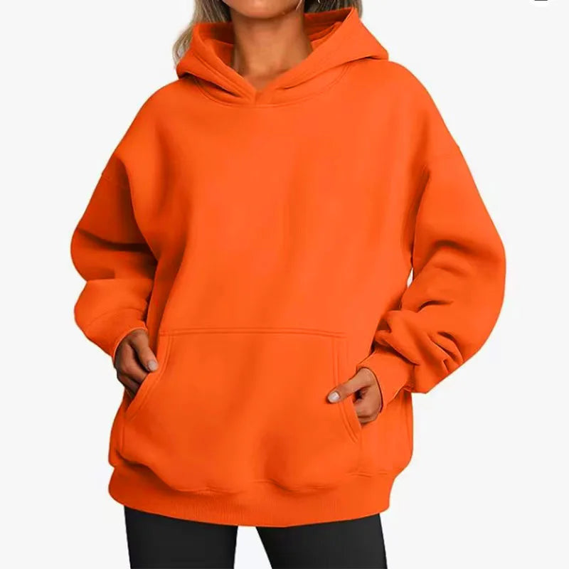Orange hoodie worn by a person on a white background