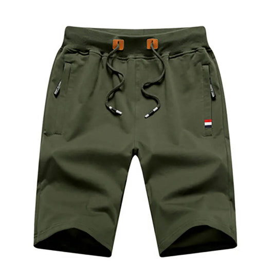 Green shorts with drawstring on a white background
