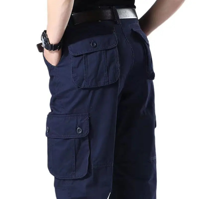 Navy blue cargo pants with multiple pockets on a white background