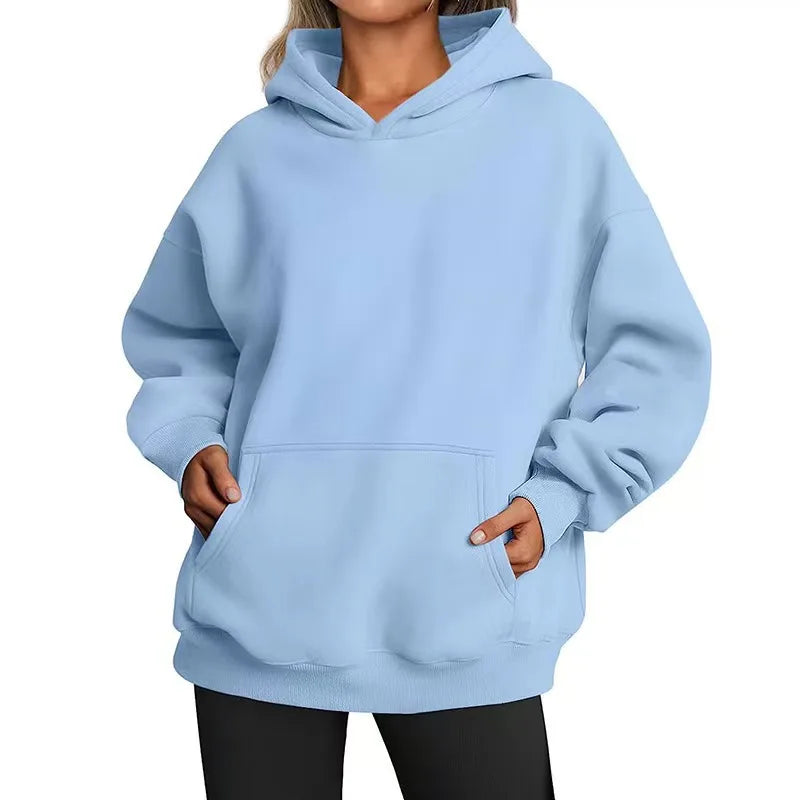 Light blue hoodie worn by a person on a white background