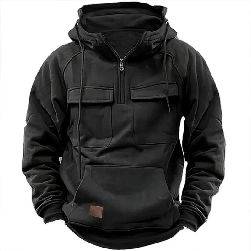Black hoodie with front pocket and zipper on a white background